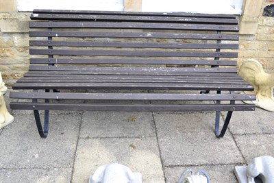 Lot 1160 - A slatted wooden garden bench