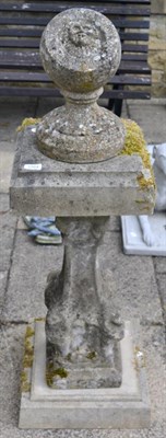 Lot 1164 - A weathered composition sundial on a baluster pillar and plinth base