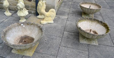 Lot 1168 - A set of three composition garden planters on plinth bases