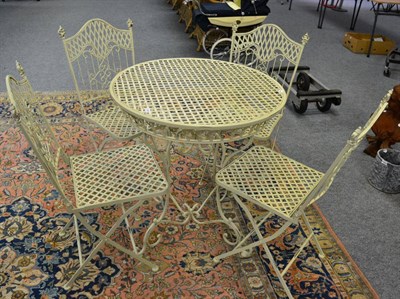 Lot 1169 - A painted metal garden table together with four matching chairs