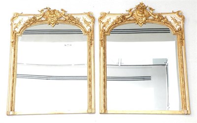 Lot 817 - A Pair of French 19th Century Gilt and Gesso Console Mirrors, with later mirror plates...