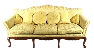 Lot 823 - A George III Style Camel-Back Sofa, late 19th/early 20th century, covered in gold and floral...