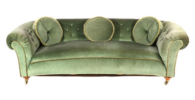 Lot 824 - A Howard & Sons Chesterfield Sofa, late 19th century, of curved form, upholstered in green buttoned