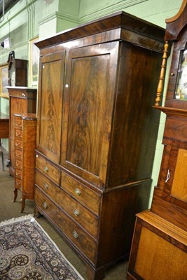 Lot 1294 - A George III mahogany linen press, with dentil cornice, converted to a wardrobe