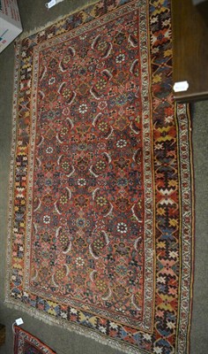 Lot 1317 - A Bidjar Rug, Persian Kurdistan, the madder Herati field enclosed by Harshang borders, 200 by 139cm