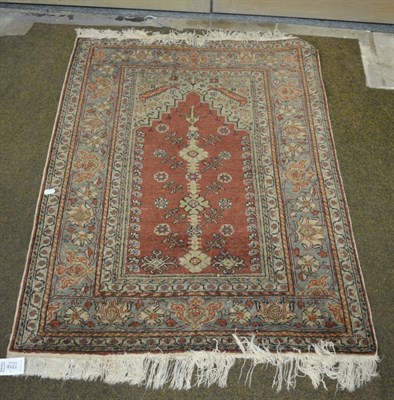 Lot 1318 - A Kayseri Prayer Rug, Central Anatolia, the chestnut field beneath a stepped Mihrab, the...