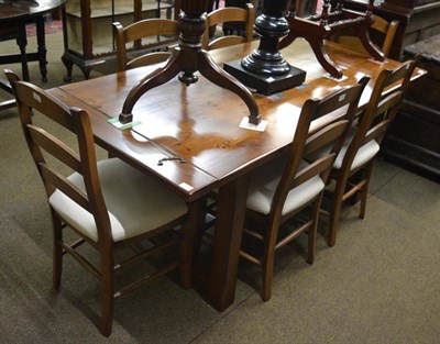 Lot 1321 - A Marks & Spencer cherrywood trestle dining table and six chairs