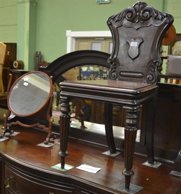 Lot 1324 - A Victorian mahogany hall chair and a Victorian toilet mirror (2)