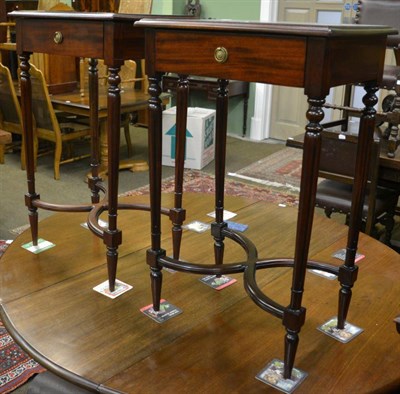 Lot 1325 - A pair of reproduction mahogany side tables with single drawer and on X-framed stretchers