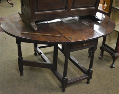 Lot 1331 - An 18th century six seater gateleg table