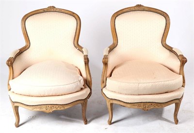 Lot 832 - A Pair of Louis XVI Style Beech Framed Fauteuils, 19th century, recovered in close-nailed pink...