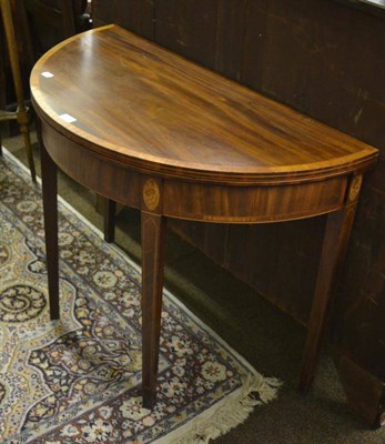 Lot 1343 - A 19th century mahogany fold over tea table