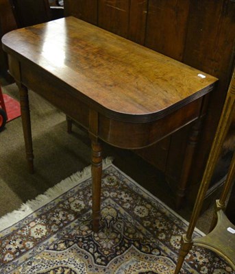 Lot 1345 - A George IV mahogany rounded rectangular fold-over tea table