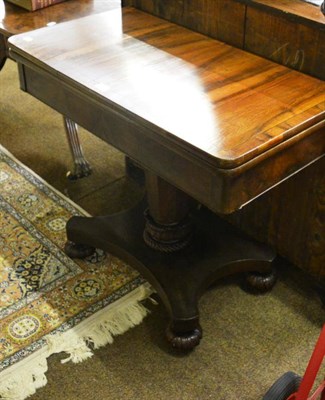 Lot 1346 - A 19th century rosewood fold-over card table on a waisted X-form platform base