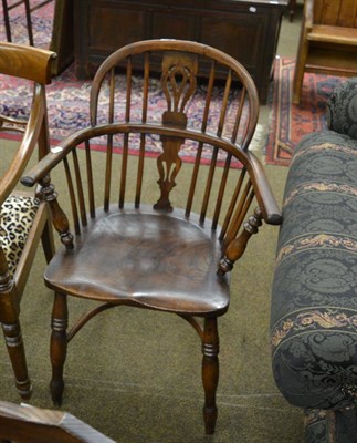 Lot 1355 - 18th century yew and elm comb back Windsor chair, stamped  N P L