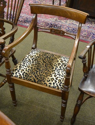 Lot 1356 - A Regency style mahogany armchair, early 20th century covered in faux leopard print