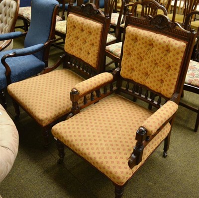 Lot 1370 - A Late Victorian walnut framed open armchair and matching nursing chair (2)