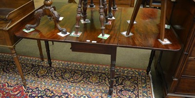 Lot 1383 - A 19th century mahogany drop leaf table