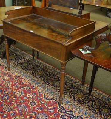 Lot 1384 - A 19th century mahogany washstand, the galleried top with hinged cover opening to reveal cut...