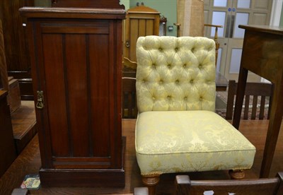 Lot 1390 - A Victorian mahogany pot cupboard and a Victorian nursing chair upholstered in yellow damask (2)