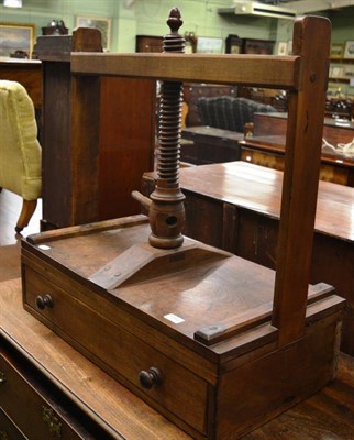 Lot 1394 - A 19th century mahogany press with turned thread and fitted with a drawer