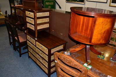 Lot 1397 - A reproduction revolving bookcase together with a modern chest of drawers and matching bedside...