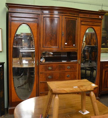 Lot 1412 - An Edwardian mahogany mirror fronted triple wardrobe