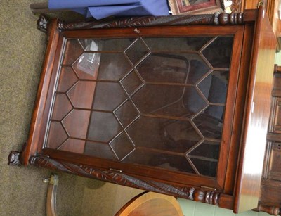 Lot 1416 - A modern carved mahogany bookcase retailed by Stern Brothers, New York with astragal glazed...