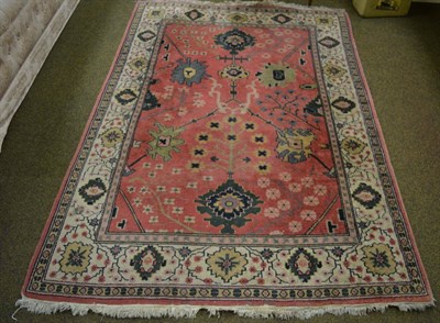 Lot 1424 - Isparta rug, central/west Anatolia, the soft raspberry field of angular stylised flower heads...