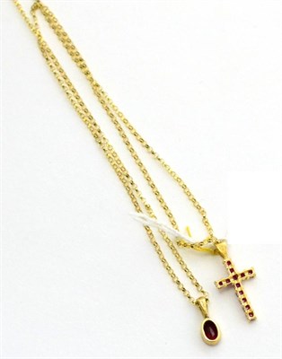 Lot 7 - A 9ct gold ruby pendant on chain and a ruby cross pendant