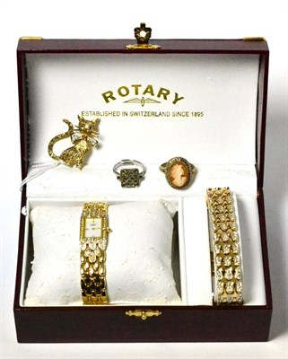 Lot 10 - A 9ct gold ruby, sapphire and diamond cat brooch, two rings and a Rotary lady's wristwatch with...