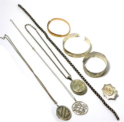 Lot 11 - Assorted silver lockets, bangles etc (8)
