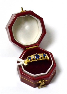 Lot 14 - An 18ct gold sapphire and diamond five stone ring