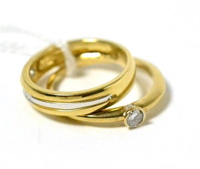 Lot 33 - A 9ct two colour gold diamond solitaire ring and a 9ct two colour gold diamond half hoop ring