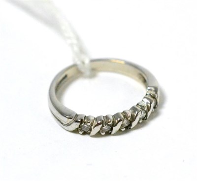 Lot 41 - An 18ct white gold diamond half hoop ring