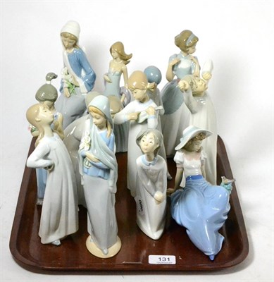 Lot 131 - Eleven Lladro figurines, ladies and girls in various poses, together with a Nao figure and a...