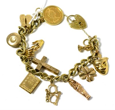 Lot 140 - A 9ct gold charm bracelet with a 1982 half sovereign