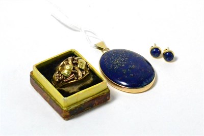 Lot 147 - An elaborate yellow metal signet ring stamped '18K' with a lapis lazuli pendant and a pair of...