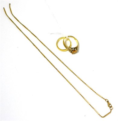 Lot 172 - A 22ct gold band ring, a 9ct gold fancy link necklace and a dress ring (3)