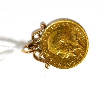 Lot 186 - A 1913 half sovereign soldered to a charm mount