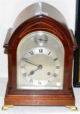 Lot 210 - A quarter striking mahogany table clock