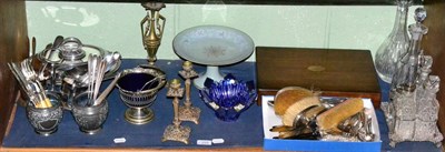 Lot 225 - A shelf of plated ware, glass, three piece silver backed dressing table set, six prints, etc