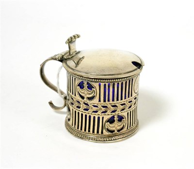 Lot 250 - A silver mustard with blue glass liner