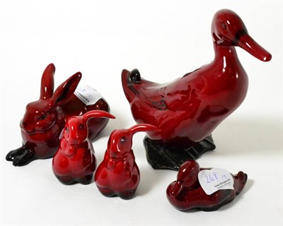 Lot 268 - A group of five flambe animals, three hares, a duck and a duckling (5)