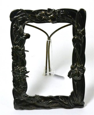 Lot 273 - A Japanese white metal photograph frame, repousse with irises