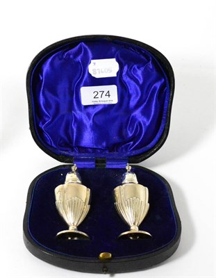 Lot 274 - A pair of silver pepperettes (cased) and a silver milk jug and bowl on stand