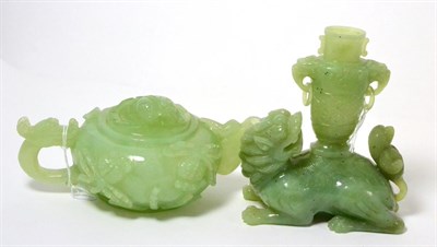 Lot 276 - A Chinese jade teapot with cover together with a jade temple lion surmounted by a miniature...