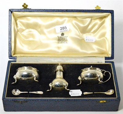 Lot 285 - A Garrard & Co Ltd cased silver three piece cruet set with spoons, London, 1957