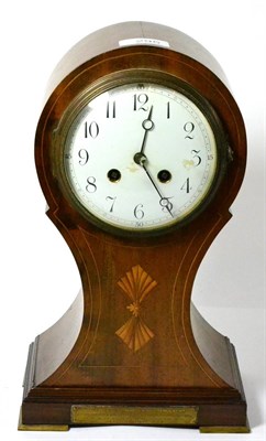 Lot 295 - A balloon shaped striking inlaid mantel clock