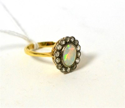 Lot 309 - An opal and diamond set ring